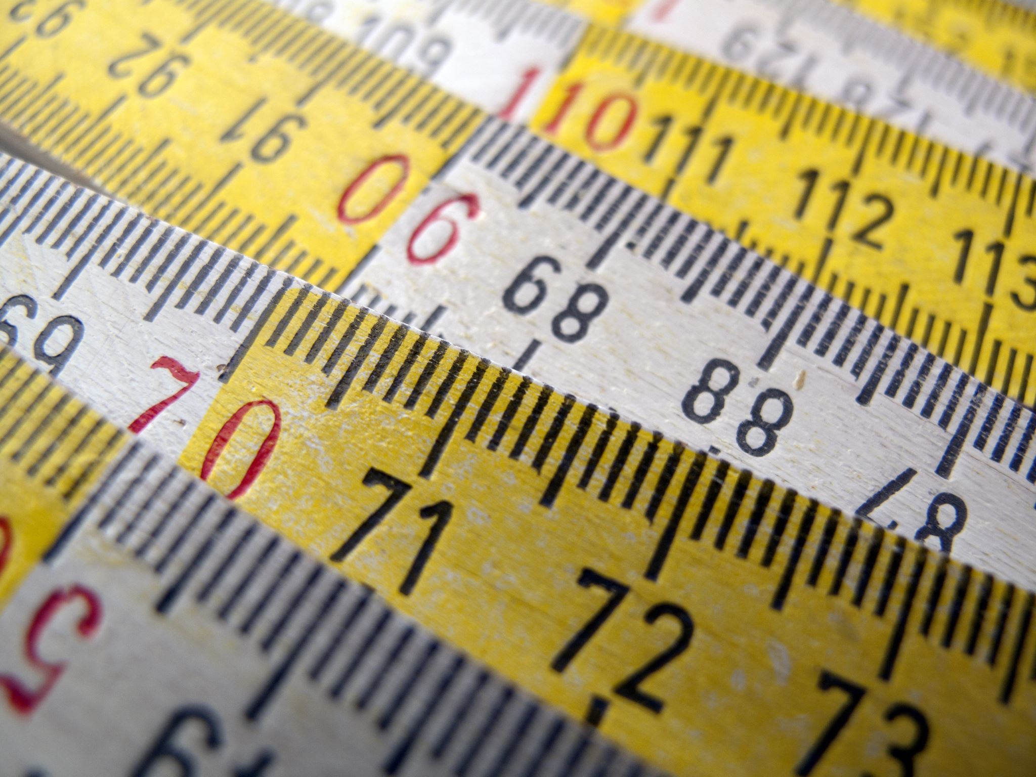 Close-up-of-wooden-white-and-yellow-ruler