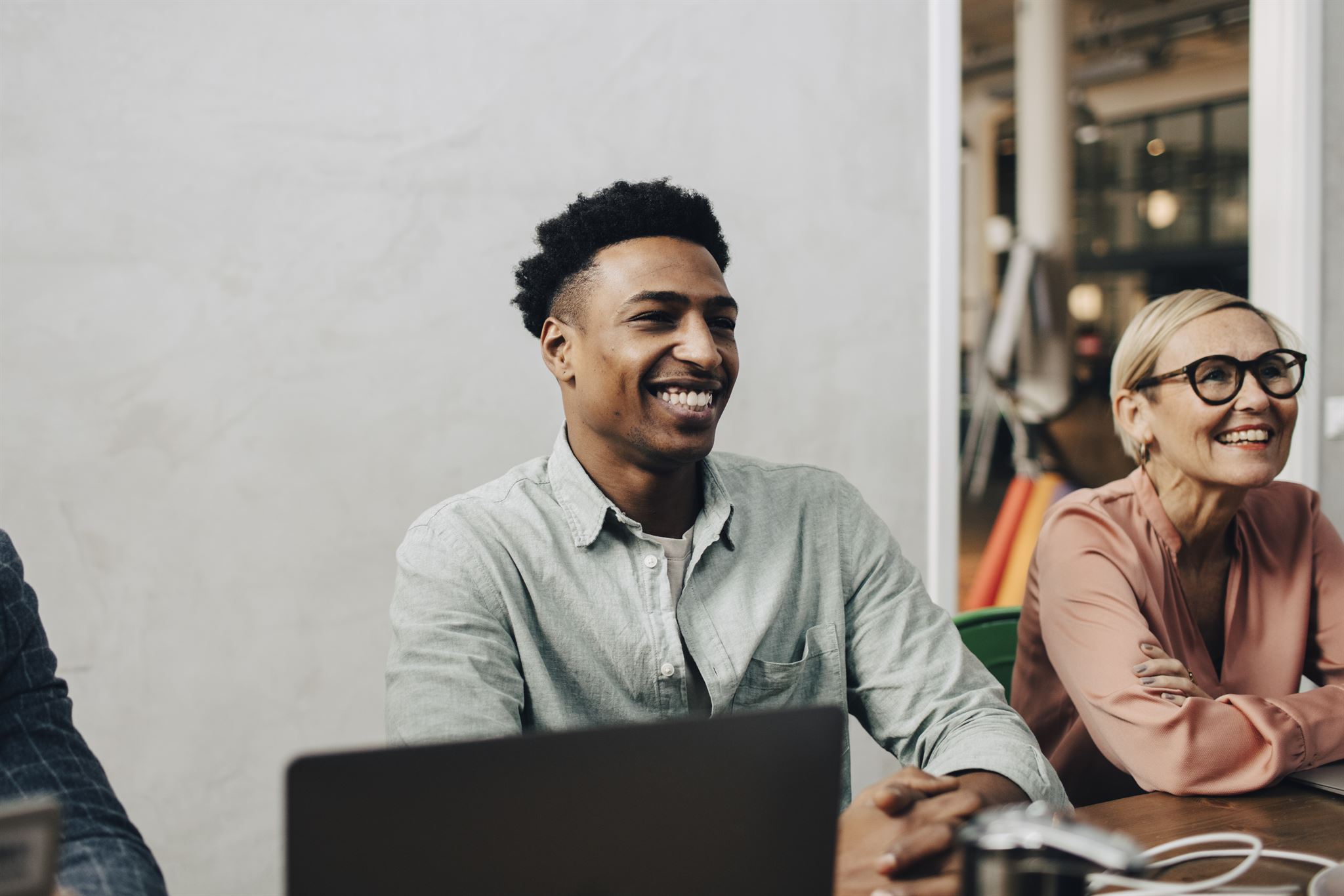 Smiling-people-at-conference-table